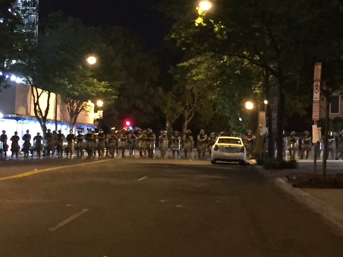 Military Police with riot shields holding entrances past Farragut