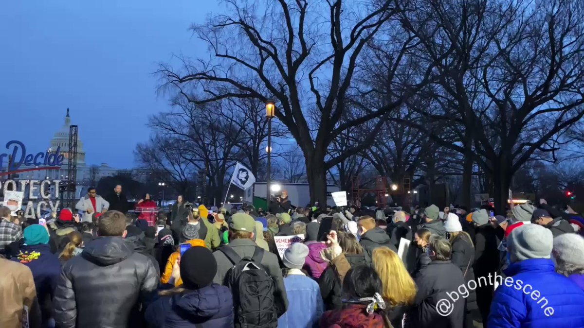 Hundreds are gathered outside the Capitol this evening, as progressive activists and Democrat lawmakers hold a 'January 6 Candlelight Vigil for Democracy' on the west side of the Capitol Building January6th