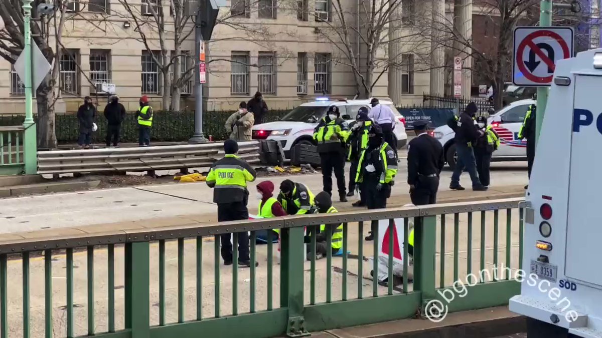 DC Police Department officers move in to handcuff and arrest three Declare Emergency climate protesters for blocking the roadway. Police leaving the scene at Massachusetts & 13th, reopening the roadway after this morning's arrest of three climate activists here in DC