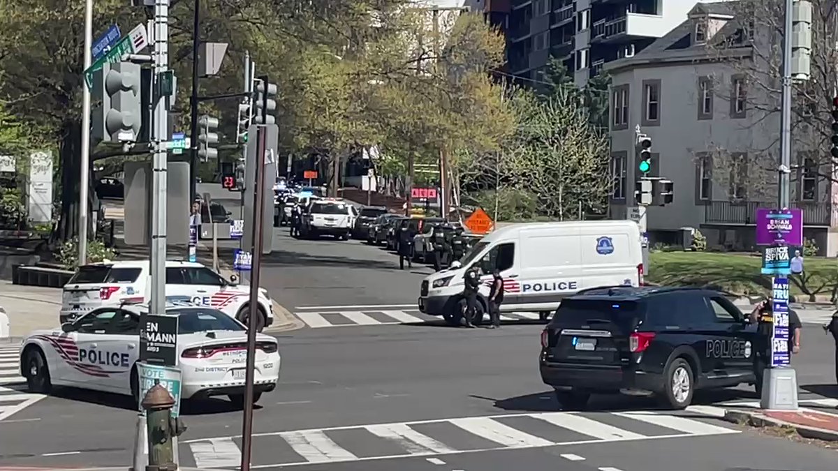 People here at the intersection of Connecticut and Van Ness said they saw shooting toward a nearby school. We have seen policemen going down an alleyway with guns. This scene appears to be active. People here are distraught