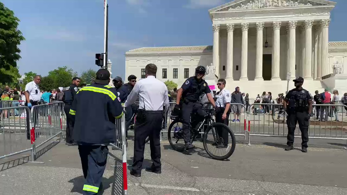 From the Supreme Court where more fences are going up. A whole lot more. Walked here to find a network of metal barricades splitting the road in half, and police lifting more over the sidewalk into the Capitol lawn