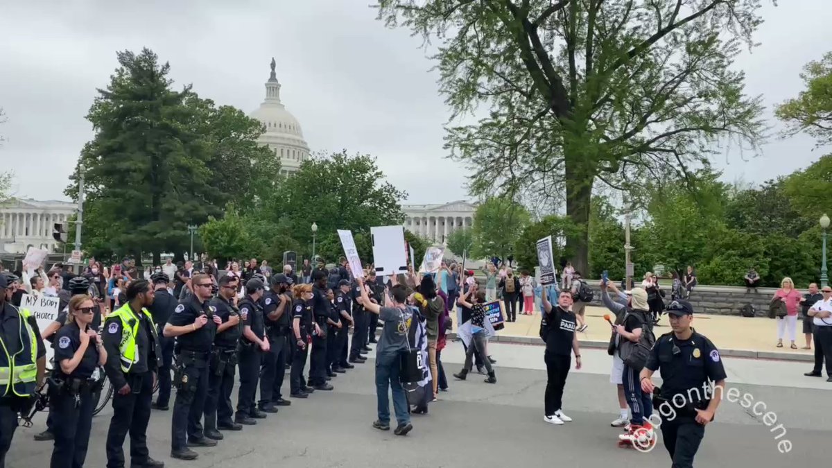 Capitol Police are separating opposing groups outside the Supreme Court