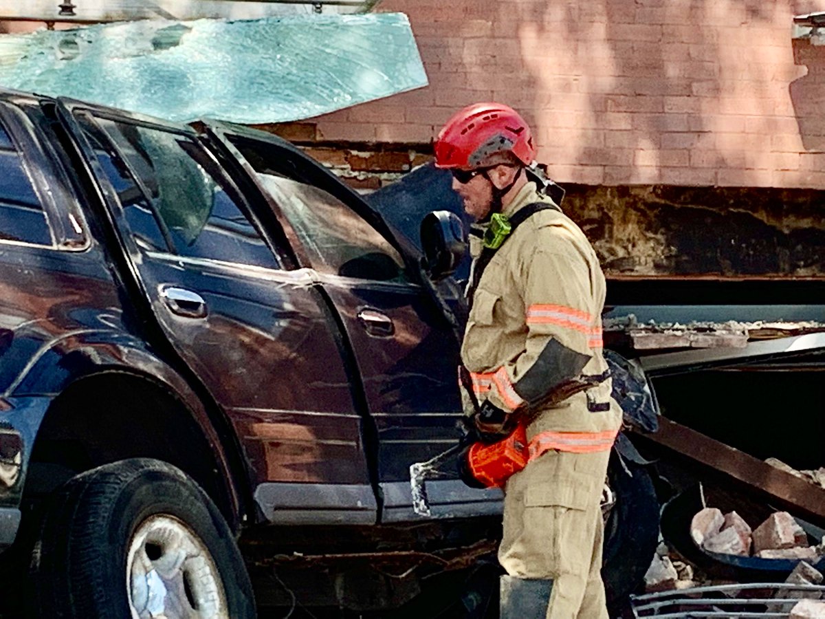 Vehicle into structure 14th St & Meridian Pl. NW. Driver is uninjured and no occupants inside at time of incident. DC firefighters conducting structural assessment, securing utilities, and have established a safety zone