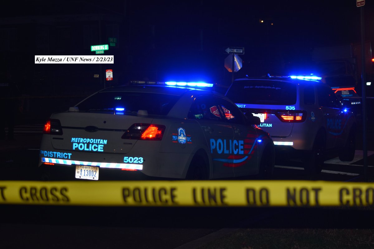 Metropolitan Police Department in Washington, DC on February 23, 2023 conducts a shooting Investigation in the 1400 block of Downing Street NE. Multiple police vehicles and crime scene tape can be seen on-scene