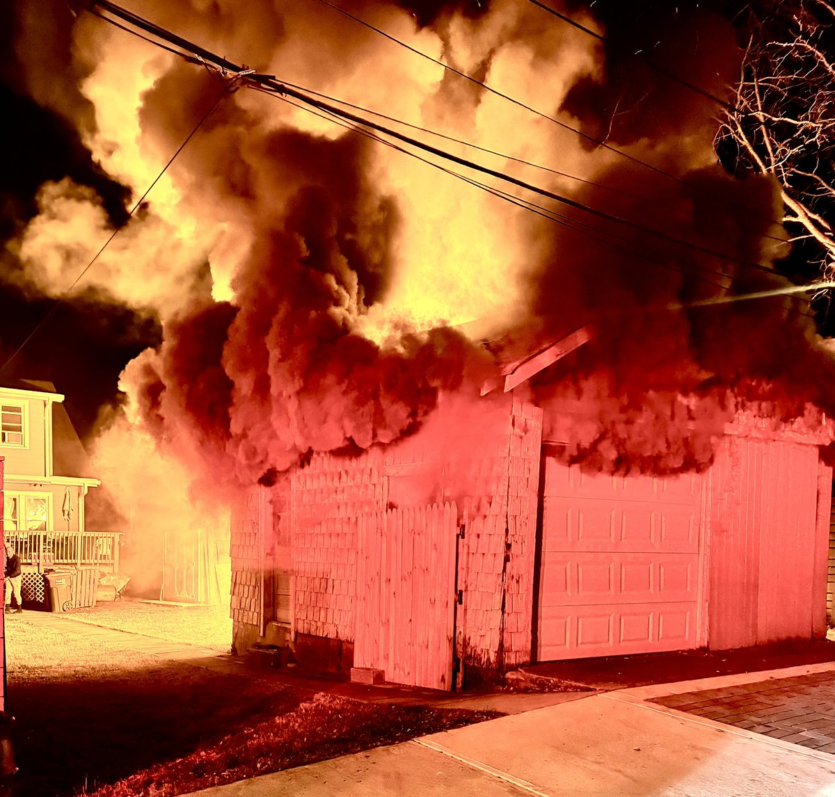 Box Alarm 1200 block Gallatin St NW. Fire involving two 1.5 story garages in rear alley threatening adjacent lightweight apartment building. DC firefighters