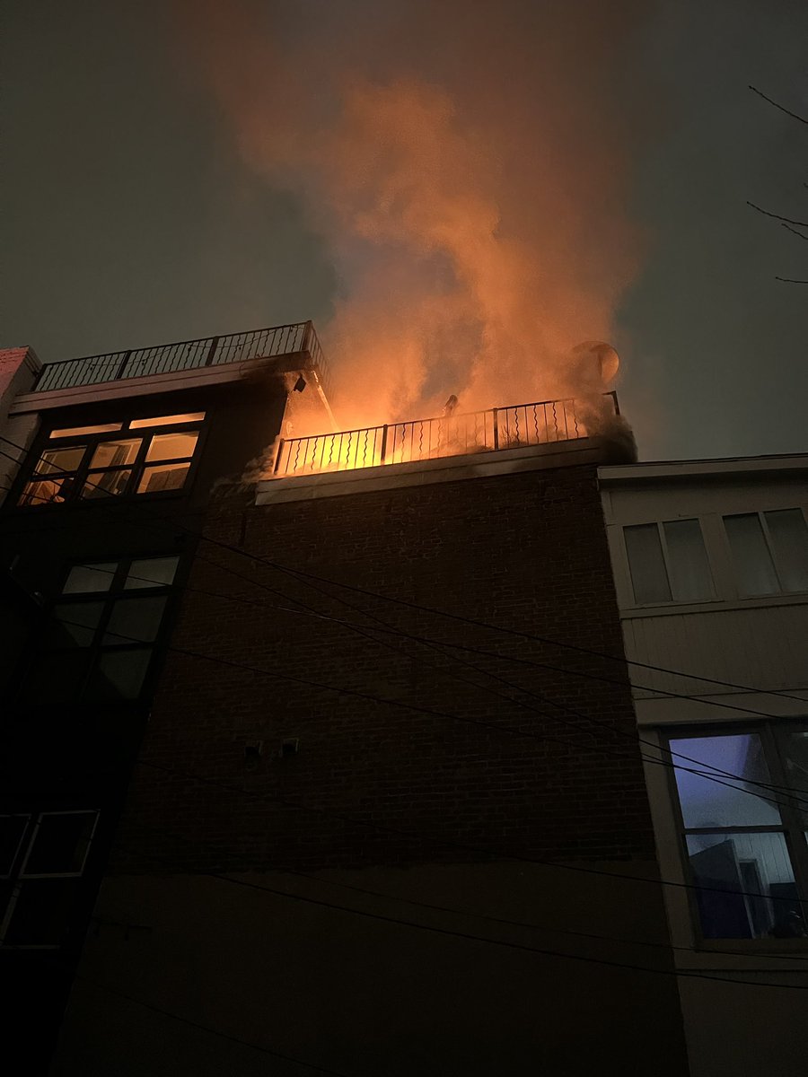 1800 block of 5th st NW initial report of fire showing on the roof of the rear of 4 story apartment building DC firefighters