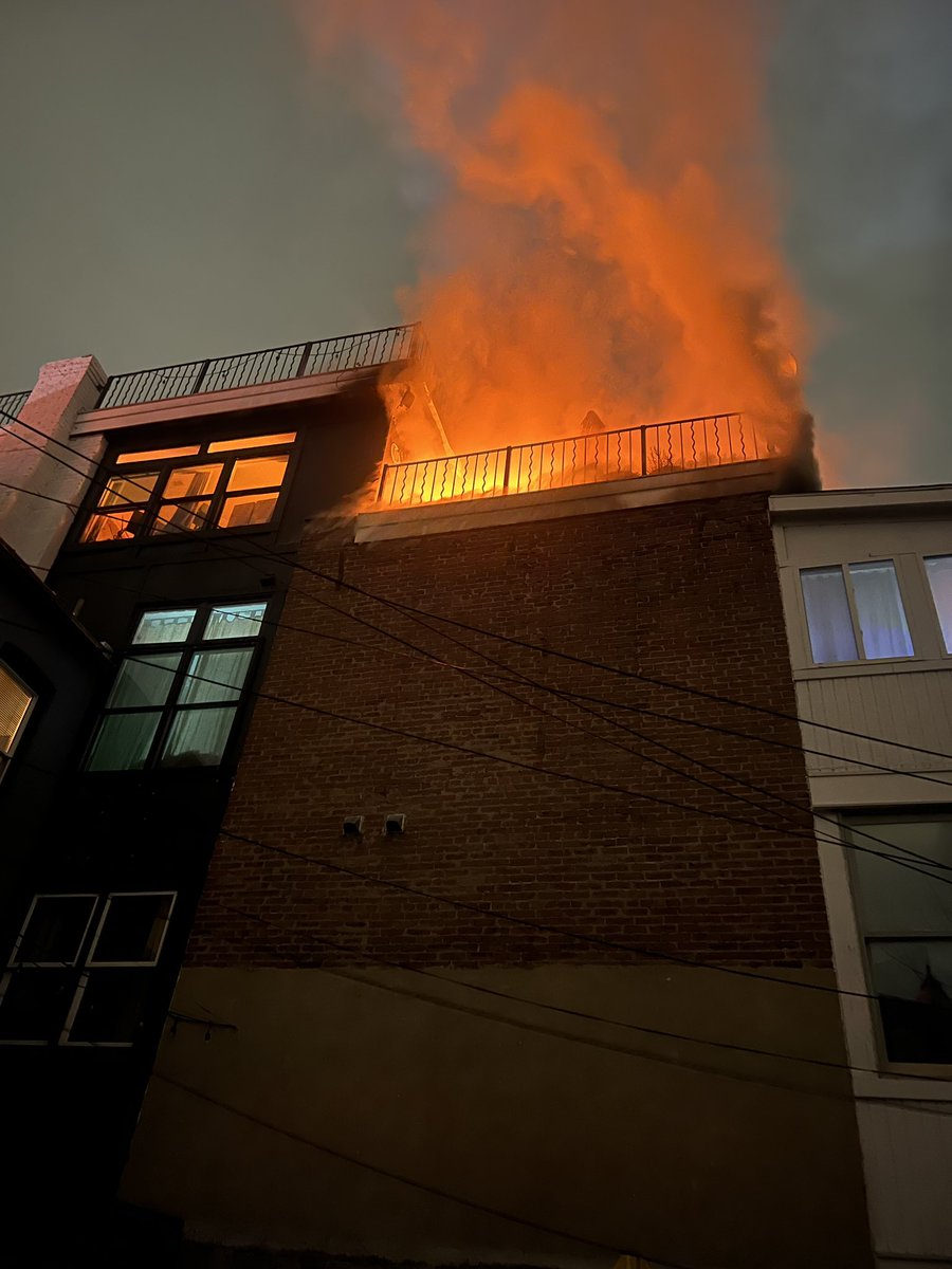 1800 block of 5th st NW initial report of fire showing on the roof of the rear of 4 story apartment building DC firefighters