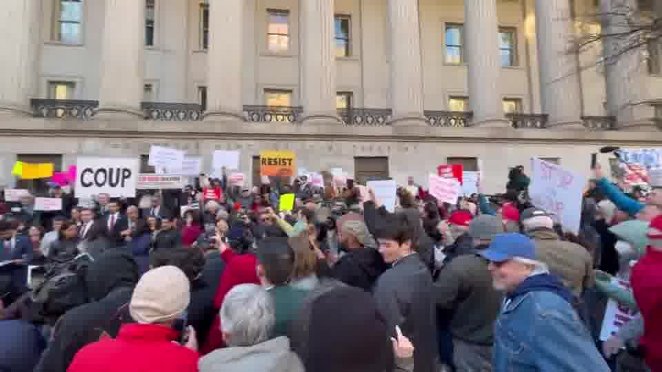 Chants of Hey Hey Ho Ho Elon Musk has got to go outside Treasury.   I'd estimate a few hundred people, plus maybe two dozen Dem lawmakers, are here