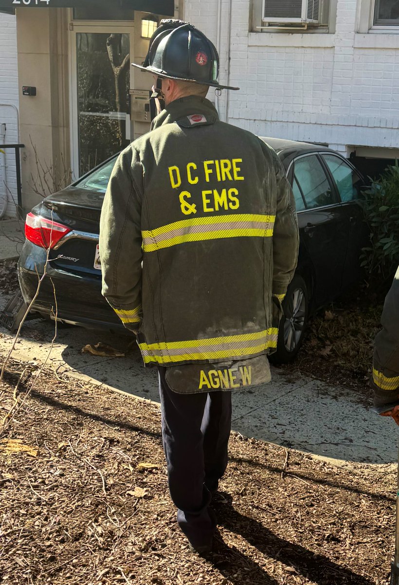 Vehicle striking building 2300 block 41st St NW. 2 occupants of vehicle did not require medical attention. Vehicle partially into basement laundry room. Rescue Squad determined no structural damage. No utilities compromised. No injuries or displacements. DC firefighters