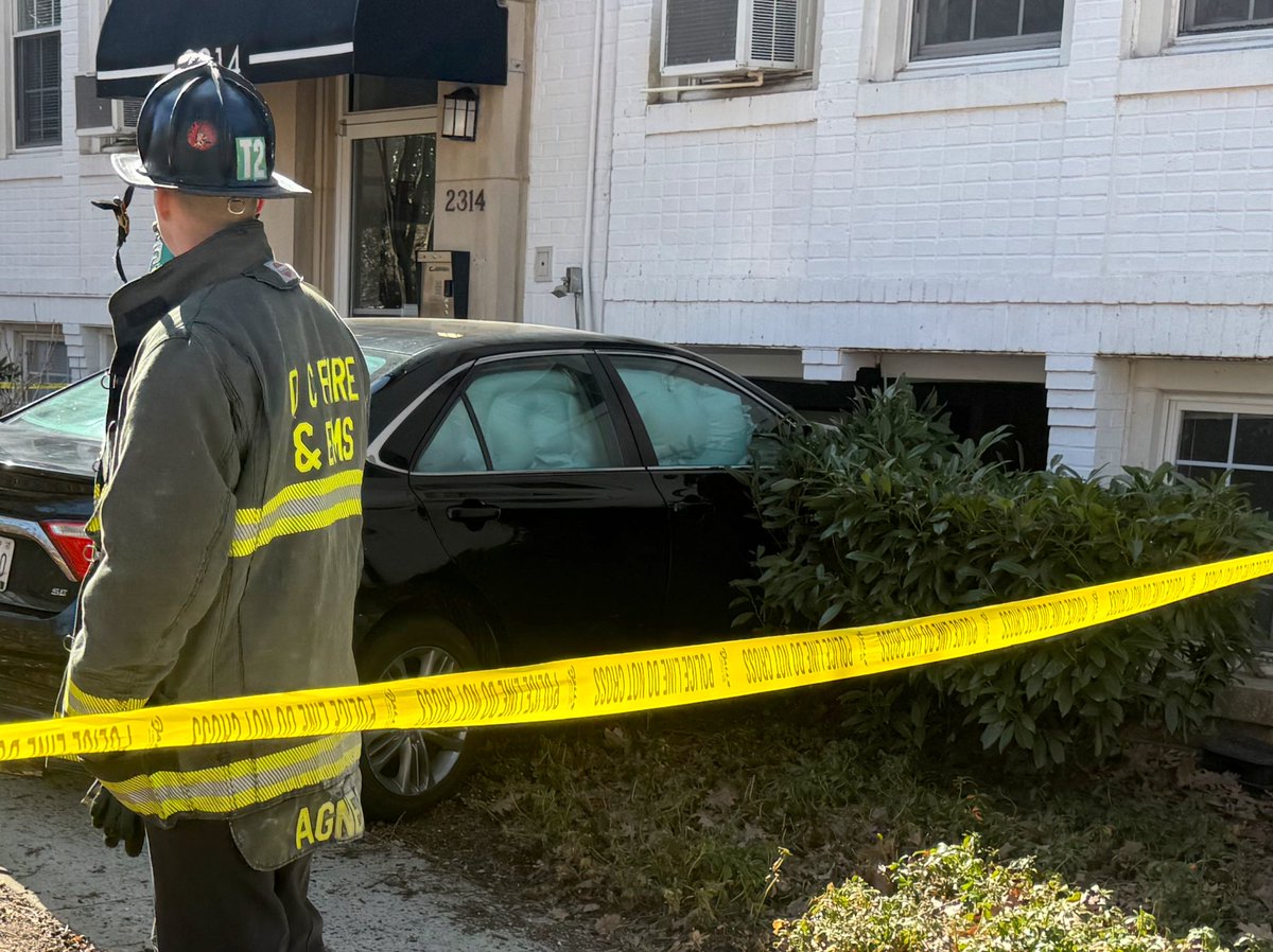 Vehicle striking building 2300 block 41st St NW. 2 occupants of vehicle did not require medical attention. Vehicle partially into basement laundry room. Rescue Squad determined no structural damage. No utilities compromised. No injuries or displacements. DC firefighters