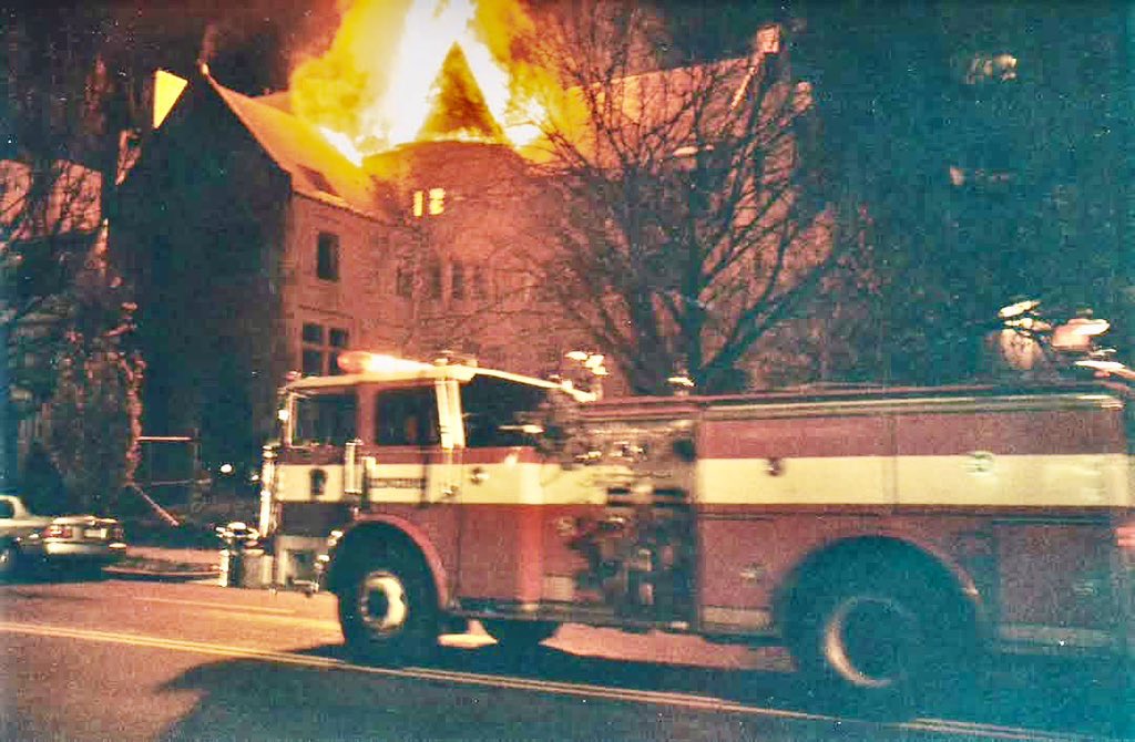 Fire breaks thru the roof of the vacant Antioch law school as Engine 4 arrives on the scene. This 2nd Alarm in the 2600 block of 16th St NW took place during the 90’s.