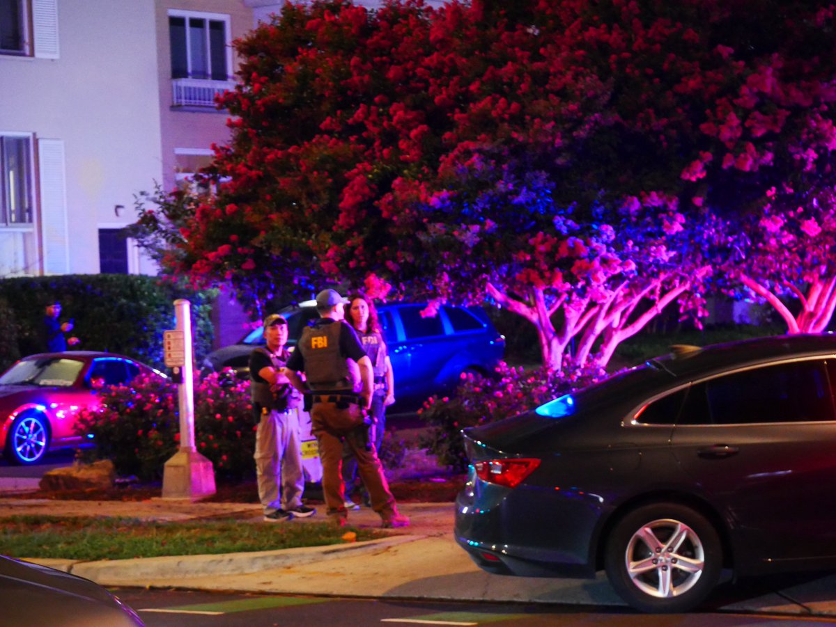 Federal agents and MPD officers detain a man near a vehicle at Delaware Ave SW & I Street SW, just a few blocks from DC Police’s 1st District station in Southwest DC