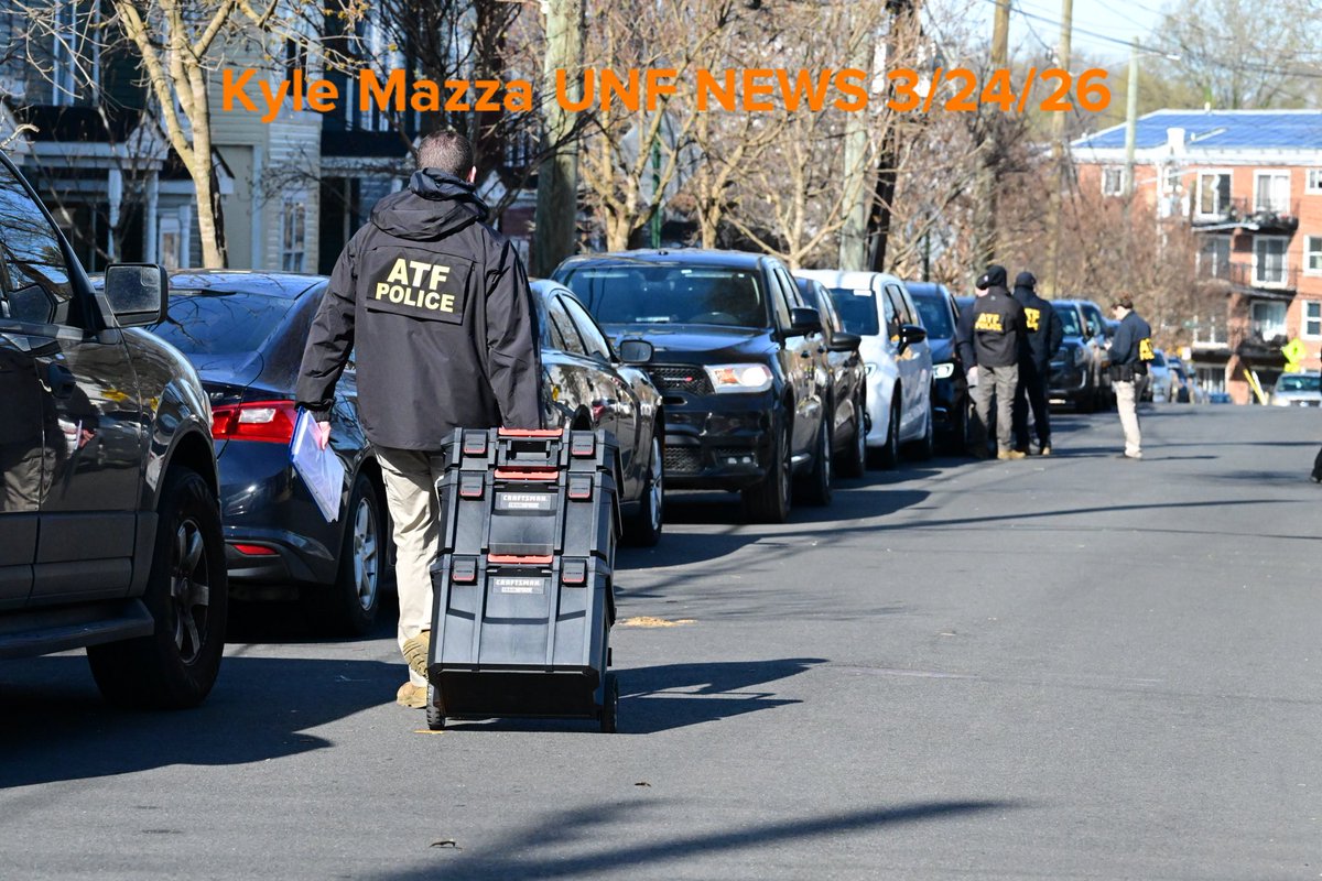 Metropolitan Police Department officers, U.S. Marshals and agents with the Bureau of Alcohol, Tobacco, Firearms and Explosives (ATF) execute a search warrant at the scene where overnight a U.S. Park Police officer was shot in Southeast, Washington, D.C. on March 24, 2026. The officer was shot while inside an unmarked vehicle on the 5000 block of Queens Stroll Place SE