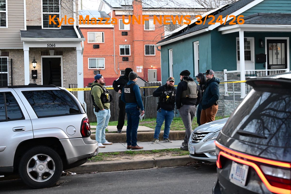 Metropolitan Police Department officers, U.S. Marshals and agents with the Bureau of Alcohol, Tobacco, Firearms and Explosives (ATF) execute a search warrant at the scene where overnight a U.S. Park Police officer was shot in Southeast, Washington, D.C. on March 24, 2026. The officer was shot while inside an unmarked vehicle on the 5000 block of Queens Stroll Place SE